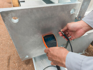 Measure the Coating Thickness Galvanized with a Coating Thickness Gauge by Specification of Project for Steel Structure Work at Industrial Factories.