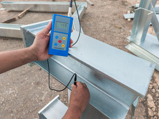 Measure the Coating Thickness Galvanized with a Coating Thickness Gauge by Specification of Project for Steel Structure Work at Industrial Factories.