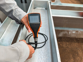 Measure the Coating Thickness Galvanized with a Coating Thickness Gauge by Specification of Project for Steel Structure Work at Industrial Factories.