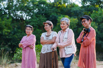 Senior Asian women smiling outdoor cheerful posing casual clothing nature vacation travel adventure freedom leisure lifestyle refreshing exploration friendship journey happiness