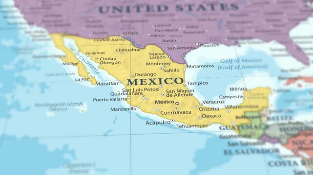 4K macro footage of Mexico on a world map with shallow depth of field. Focus on word Mexico and nearby regions like the United States, Central America, and the Gulf of Mexico. Travel geography footage