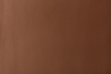 Fototapeta premium Texture of genuine leather, artificial leatherette brown background