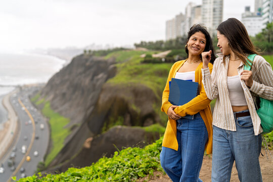 College students conversing cheerfully after class