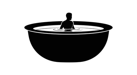 Silhouette of a person relaxing in a large bowl of water.