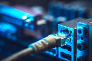 Fiber Optic cables connected to an optic ports and Network cables connected to ethernet ports.