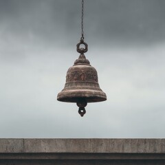 Vintage Bell Hanging from Chain Against Dramatic Cloudy Sky in Serene Outdoor Setting