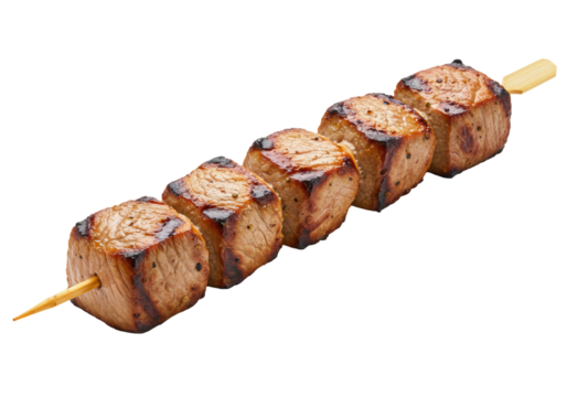 Single skewer of succulent, golden-brown grilled beef shish kebab cubes with char marks on a wooden stick, diagonally on a transparent background. Appetizing gourmet food concept
