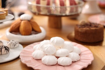 Buffet menu. Different delicious desserts on table, selective focus