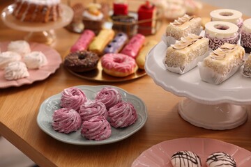 Buffet menu. Different delicious desserts on table, selective focus