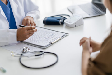 Fototapeta premium physician discusses health concerns with a patient in a medical consultation