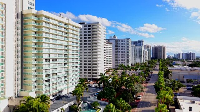 Aerial rising clip highrise condominiums on the ocean. Drone footage of Lauderdale by the Sea Galt Ocean Mile