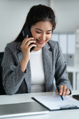 female making business call talking on the phone in office, cooperate conversation