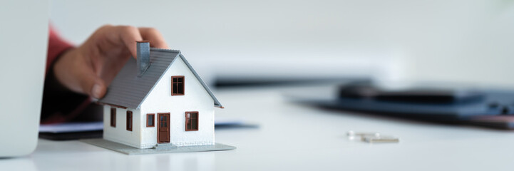 financial expert reviews house contract and loan calculation in office