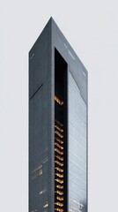 Modern Skyscraper with Unique Architectural Design and Sleek Glass Facade Against Gray Sky