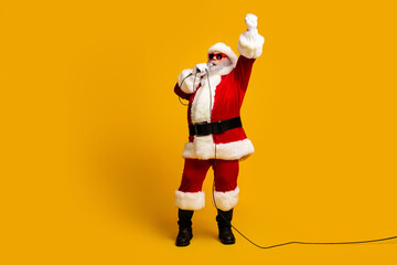 Santa Claus singing passionately with festive spirit against a bright yellow holiday backdrop,...