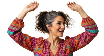 Joyful woman dancing with arms raised embracing vibrant colorful clothing isolated on white background