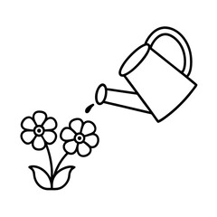 a watering can pouring water on blooming flowers
