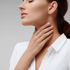 Young woman expressing calmness while touching her throat in studio  