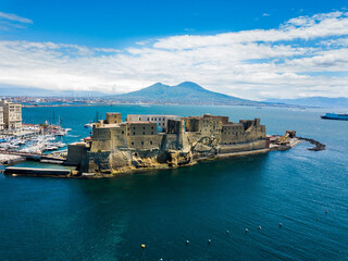 Castel dell'Ovo, Naples, Italy - aerial view of the castle with Mount Vesuvius in the background