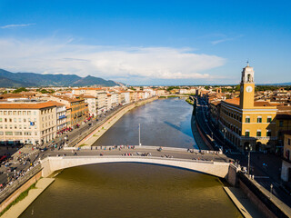 Pisa, Italy - aerial view of a bridge on the Arno River in the middle of the city