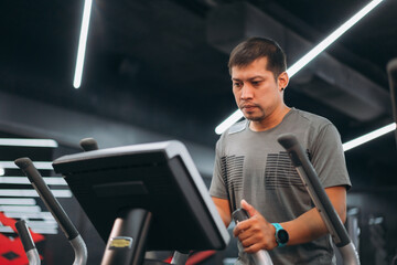 Smiling man exercising on treadmill in modern gym, symbolizing healthy lifestyle, cardio workout, motivation, and fitness training for wellness, energy, and everyday health improvement.