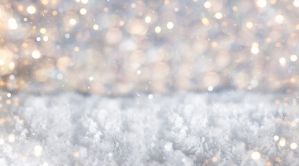 Winter scene with snowy foreground and golden bokeh lights creating a festive atmosphere