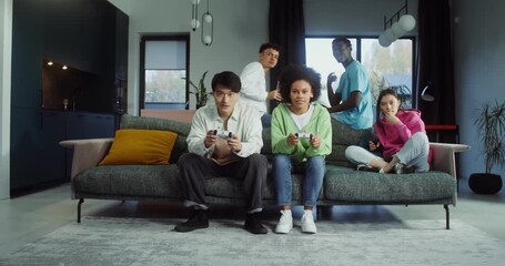 A group of young people gathered for a video game party