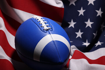 American football ball and USA flag. Sport game. Super bowl in US. Football ball Close Up macro photography with copy space.