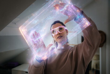 Woman using AR glasses to manipulate glowing holographic interface