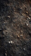 Abstract Earth Texture: A close-up view reveals a complex, textured surface composed of earth and small stones, showcasing natural patterns and the raw beauty of the earth.