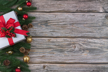 Christmas composition on wooden background with gift box and copy space