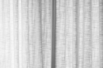 A minimalist close-up photo of white sheer fabric curtains
