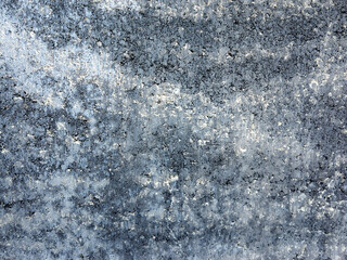 A textured gray surface with subtle patterns and highlights, offering an elegant modern aesthetic