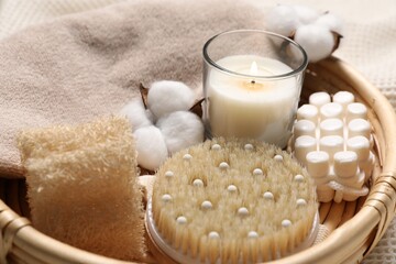 Beautiful composition with spa essentials on light fabric, closeup