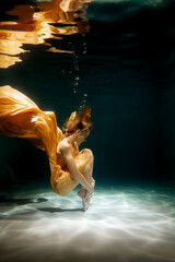 An Ethereal Underwater Dance Featuring Flowing, Weightless Fabric that Enchants the Eye