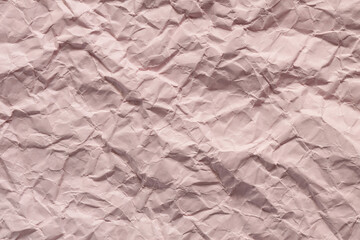 Textured Pink Crumpled Paper Background with Wrinkles and Folds