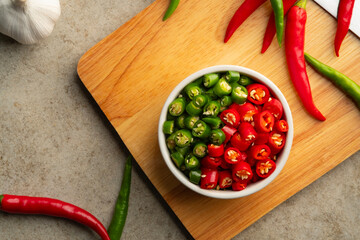 Sliced Red Chilli and green Chili Pepper in a bowl.(Thai Chili Jinda).Top view.