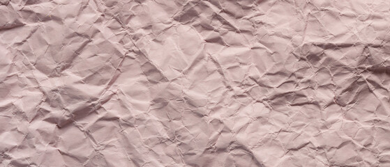 Textured Pink Crumpled Paper Background with Wrinkles and Folds