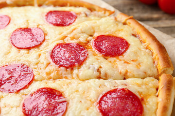 Delicious baked pepperoni pizza on table, closeup