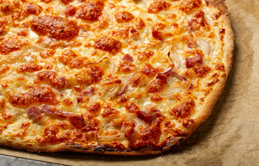 tart flambe, open pie, rectangular pizza, with cheese and red onion, bacon slices, Alsatian dish, homemade, no people,
