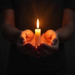 Lit Candle Held in Hands in Darkness Symbolizing Hope, Peace, and Reflection