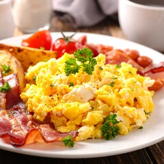 Plate with a hearty breakfast, including scrambled eggs and bacon