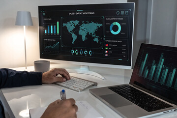 Professional analyzing global sales and export overview on a large monitor, leveraging international trade analytics