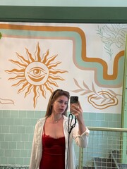 young girl doing selfie in a mirror