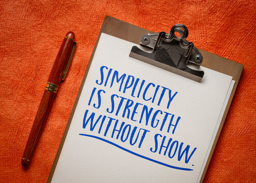 simplicity is strength without show - inspirational note on a clipboard
