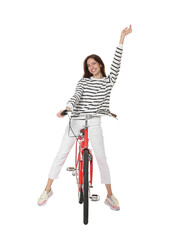 Smiling woman posing on red bicycle against white background
