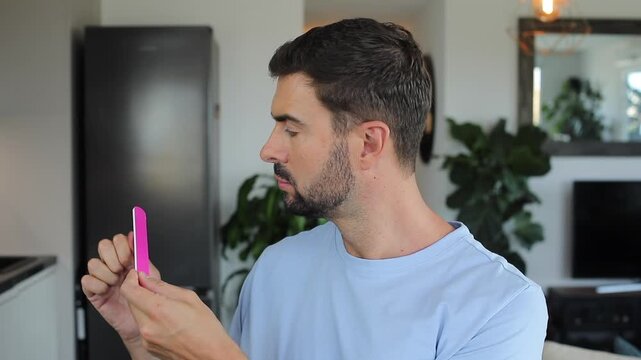 Man gossiping while doing his nails 