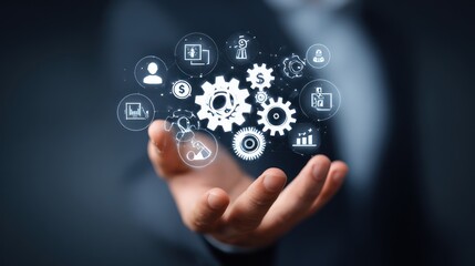 Hand holding gears with icons representing business and technology concepts