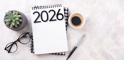 New year goals 2026 on desk. 2026 resolutions list with notebook, plant on table. Resolutions, plan, goals, action, checklist, idea concept. New Year 2026 resolutions, copy space