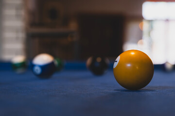 Colorful billiard balls on an american pool table. Vibrant pool balls on felt table surface. 